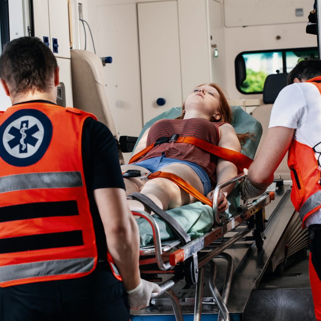 Binge Drinking victim lies on a stretcher in an ambulance