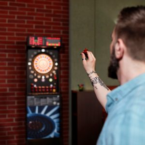 Bar Games - Man playing darts